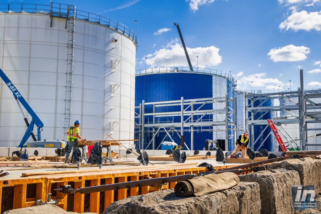 In the shadow of refineries, a green energy plant rises in Linden